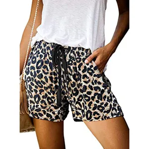Close-up of leopard print high waist shorts featuring black drawstring and pockets