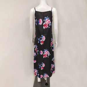 Back view of elegant black maxi slip dress with pink floral prints and thin straps