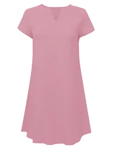 Close-up of pink V-neck loose woven dress with short sleeves and soft fabric texture
