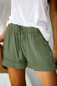 Detailed close-up of army green high-waisted casual shorts with drawstring waist