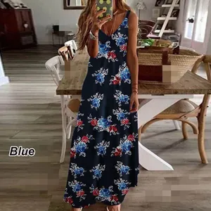 Detail view of a navy blue sling maxi dress with vibrant red and blue floral patterns