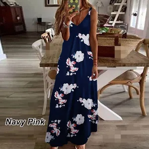 Full length view of a navy blue floral print maxi dress with V-neck on a model