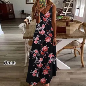 Close-up view of a black floral spaghetti strap maxi dress with rose print details.