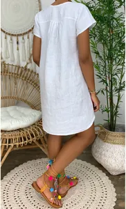 Back view of a loose white cotton linen short sleeve casual dress for summer fashion