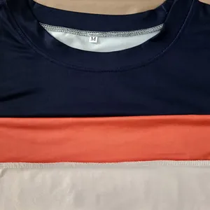 Close-up detail of color-block crew neck sweatshirt with navy, orange, and white panels