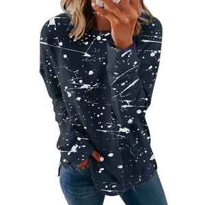 Detail view of a women's navy long-sleeve T-shirt featuring a white graffiti paint splatter