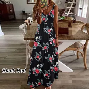 Summer floral maxi dress with red flower print and spaghetti straps in lifestyle setting