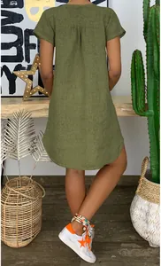 Detail view of the back of a green cotton linen loose short sleeve mini dress