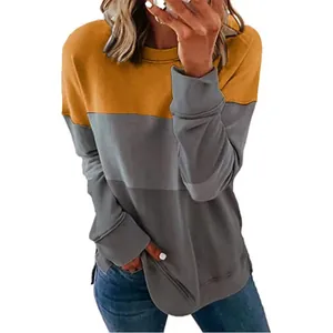 Vista detallada de una sudadera informal de mujer con bloques de color amarillo y gris