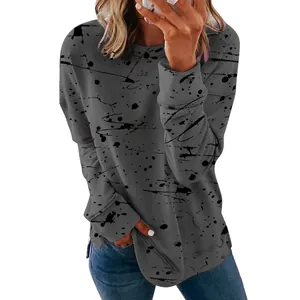 Detail view of casual grey long-sleeved shirt featuring artistic black splatter print design