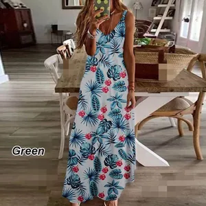 Full length view of a tropical print summer maxi dress in a casual home interior setting.