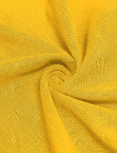 Close-up detail of high-quality bright yellow woven fabric texture for a summer dress