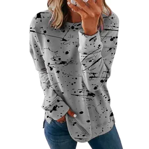 Close-up of casual gray long sleeve T-shirt with creative black graffiti ink splash print.