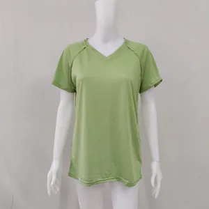 Detailed view of women's loose V-neck short sleeve T-shirt in light green fabric