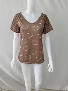 Close-up detail of a brown V-neck T-shirt featuring heart print and striped short sleeves