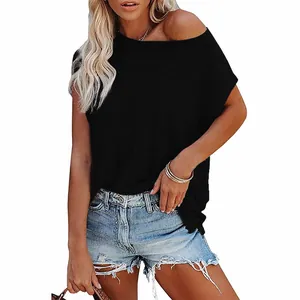 Casual black off-the-shoulder batwing sleeve t-shirt for women paired with denim shorts