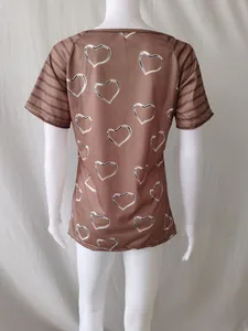Back detail view of brown heart print short sleeve casual t-shirt for women displayed on mannequin
