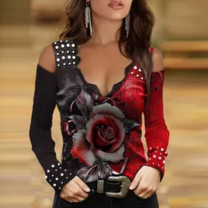 Detailed view of vibrant red rose print on a cold-shoulder V-neck long sleeve women's top