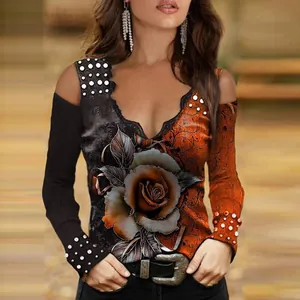 Close-up detail of a cold-shoulder V-neck top with elegant rose print and pearl accents