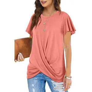 Detail of coral pink short sleeve T-shirt with twist knot front design and crew neck