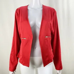 Close-up view of a vibrant red open-front blazer with stylish silver zipper pockets