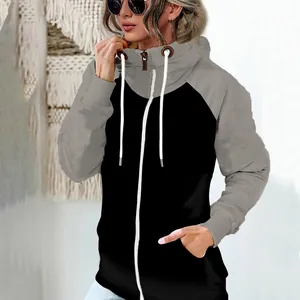 Detailed view of women's two-tone grey and black zip-up fleece hoodie with high neck