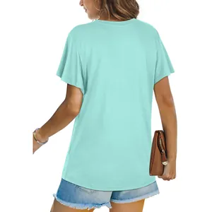 Back view of a casual mint green short-sleeved t-shirt for women in a studio