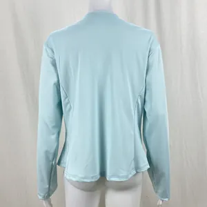 Detail back view of a light blue long-sleeved casual blazer jacket on a white mannequin