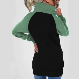 Detail view of the back of a green and black color-block high-neck plush sweatshirt