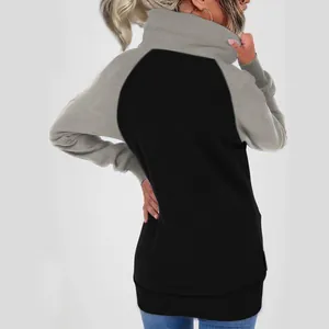 Back view of a two-tone oversized fleece hoodie in black and grey for women