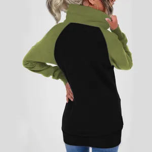Back view of a women's oversized fleece hoodie with green and black color-blocking