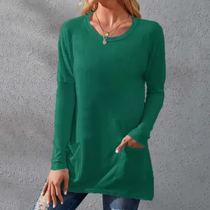 Detailed front view of green long-sleeve T-shirt showing round neckline and pocket details