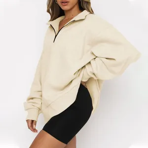 Detailed side view of an oversized cream half-zip fleece sweatshirt for women in studio