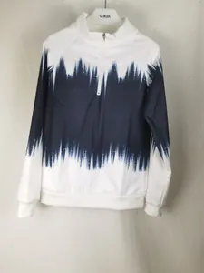 Close-up detail of a women's half-zip sweatshirt featuring a navy gradient print.