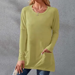 Detail showing the practical front pockets and soft fabric of the loose long-sleeve tee
