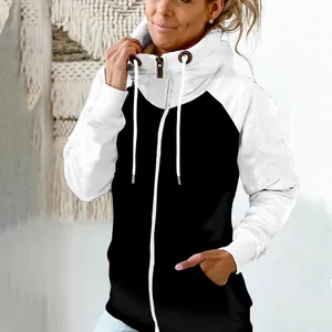 Detailed view of women's black and white two-tone fleece hoodie with warm high collar