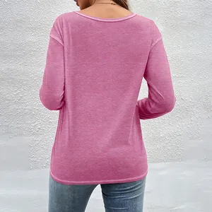Back view of a casual pink long-sleeved t-shirt featuring soft marl fabric texture