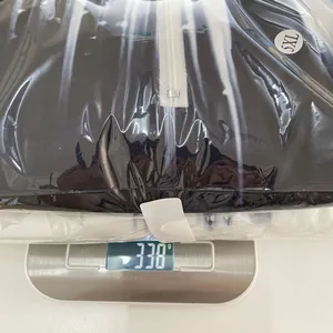Detailed macro shot showing the 338g weight measurement of this gradient winter sweatshirt