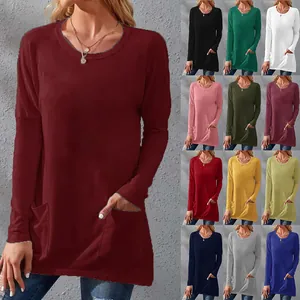 Detail view of women's loose long sleeve pocket top shown in multiple solid colors