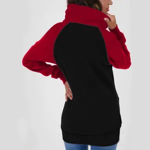 Back view of a stylish women's oversized color-block fleece hoodie in red and black