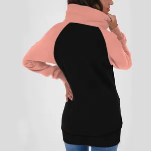 Rear view of a two-tone oversized fleece-lined hoodie for women in pink and black.