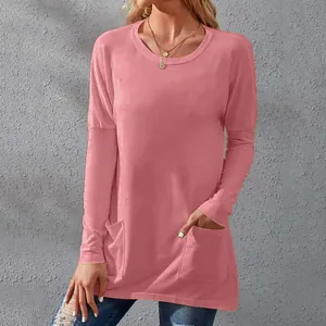 Casual women's long sleeve solid color loose fit tunic top with pockets in dusty pink