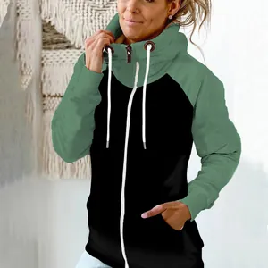Detailed view of a green and black high-neck hoodie with drawstring and zipper accents.