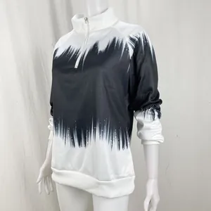 Detailed view of the black and white gradient print and half-zip on this high neck sweatshirt.