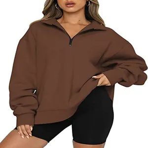 Close-up view of women's casual brown half-zip sweatshirt with warm fleece lining