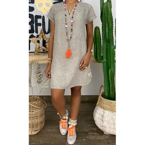 Casual grey V-neck short sleeve woven mini dress for summer outings and beach vacations.