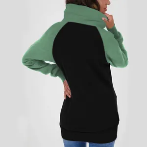 Rear view of women's two-tone cowl neck thick fleece hoodie in green and black color