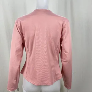 Back view of a dusty pink long-sleeve zip-up blazer for women, casual style