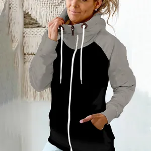 Detailed view of women's color block zip-up hoodie with high collar and drawstring.