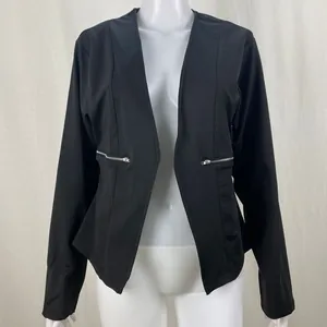 Detail view of women's black blazer with stylish silver side zipper accents